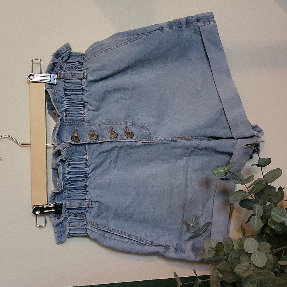 Denim shorts, ruffled waist band with button fly